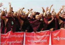  ??  ?? Monks and ethnic Mon shout slogans during a rally in Mawlamyine in Myanmar's Mon State yesterday.