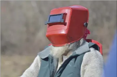  ?? ?? Eye protection is mandatory in eclipse viewing, and one of the best ways to observe the display is through a welder’s helmet.