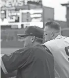  ?? KYLE ROBERTSON/ COLUMBUS DISPATCH ?? Former hitting coach Andy Tracy, left, will become the Clippers' 22nd manager when the 2021 season begins in April.