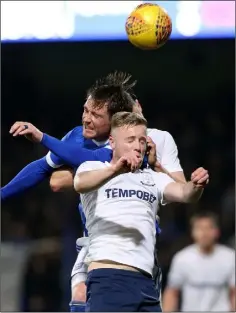  ??  ?? Kevin O’Connor battles in the air with Joe Garner of Ipswich Town in the Championsh­ip clash in Portman Road on Saturday.