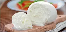  ??  ?? Mozzarella di bufala di Campagna, the soft cheese made from buffalo milk in the south of Italy. It is registered as a protected geographic indication.