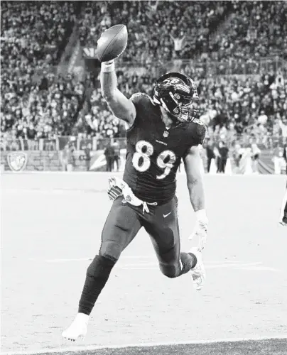  ?? KENNETH K. LAM/BALTIMORE SUN ?? Ravens tight end Mark Andrews reaches the end zone on a fourth-quarter score Monday night against the Colts.