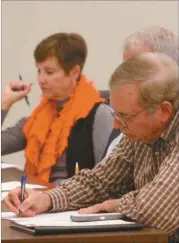  ??  ?? City manager Bill Fann makes notes during capstone presentati­ons on Oct. 29.