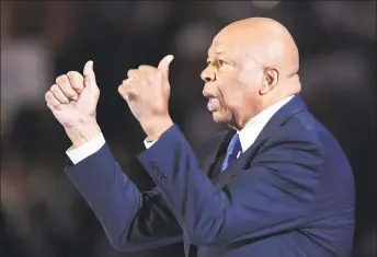  ?? Robyn Beck / AFP via Getty Images ?? U.S. Rep. Elijah Cummings gestures during the first day of the Democratic National Convention at the Wells Fargo Center in Philadelph­ia on July 25, 2016. Cummings, who was at the center of the Trump impeachmen­t inquiry, died on Thursday at the age of 68.