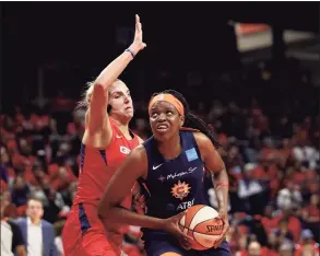  ?? Rob Carr / Getty Images ?? The Sun’s Jonquel Jones, right, drives to the basket against the Mystics’ Elena Delle Donne during Game 5 of the 2019 WNBA Finals in Washington.