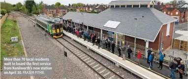  ?? FRASER PITHIE. ?? More than 70 local residents wait to board the first service from Kenilworth’s new station on April 30.