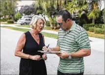  ?? DAMON HIGGINS / THE PALM BEACH POST ?? Kathy Sorkin, who lives in the Bent Tree neighborho­od south of a proposed spring training baseball stadium site, speaks with her neighbor Hawkeye Wayne in October 2013. He signs a petition to oppose the stadium.