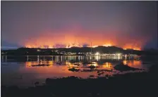  ?? Photograph: Iain Turnbull. ?? Flames and smoke billow from the burning land near Kyle of Lochalsh last week.