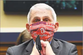  ?? Kevin Dietsch / Pool / TNS ?? Dr. Anthony Fauci, director of the National Institute of Allergy and Infectious Diseases, wearing a Washington Nationals face mask, testifies at a hearing of the U.S. House Committee on Energy and Commerce on Capitol Hill on June 23. A recent Quinnipiac poll found that 65 percent of the public trust informatio­n Fauci gives on the coronaviru­s pandemic, while only 30 percent trust President Trump’s informatio­n.