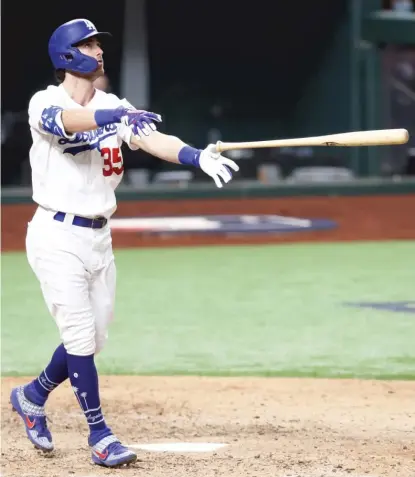  ?? GETTY IMAGES ?? The Dodgers’ Cody Bellinger tosses his bat aside after connecting for the tiebreakin­g home run in the seventh inning.