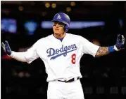  ?? HARRY HOW / GETTY IMAGES ?? Dodgers shortstop Manny Machado, who will become a free agent after the World Series, would give the Braves a powerful right-handed bat next to Freddie Freeman in the lineup.