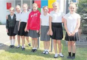  ??  ?? From left, Milly Green, Kendra Ansley, Alice Wilson, Zoe Langley, Freya Langhorn, Cariss Reed and Imogen Baly on their last day at Holly Lodge School, seven years after their brothers all ‘graduated’ from the school together.