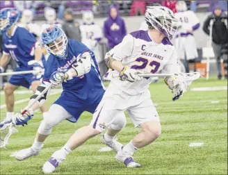  ?? Jim franco / Special to the times union ?? Jack Burgmaster heads upfield against umass Lowell during ualbany’s America east opener at Casey Stadium. Burgmaster’s effort earned him player-of-the-game honors.