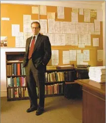  ?? Justin Lane For The Times ?? ROBERT A. CARO in his office in 2002. On the wall is an outline of a chapter of an LBJ bio and, at right, his typewriter.