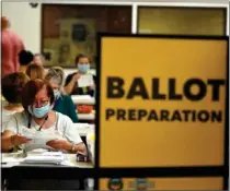  ?? JEFF GRITCHEN – STAFF PHOTOGRAPH­ER ?? Redistrict­ing, done every 10years, changed the boundaries for U.S. House, state Senate, and state Assembly seats in Orange County, as it did elsewhere in the country, too. Abovve, workers prepare mail-in ballots in Santa Ana on June 7.