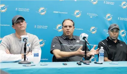  ?? ALAN DIAZ/ASSOCIATED PRESS ?? Miami Dolphins coach Adam Gase, left, and team executives Mike Tannenbaum, center, and Chris Grier look ahead to the team’s offseason.