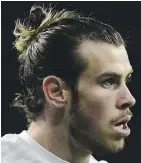  ?? JAVIER SORIANO/ AFP/GETTY IMAGES ?? Welsh soccer star Gareth Bale, shows off his man bun while playing for Read Madrid.