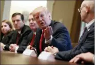  ?? EVAN VUCCI — THE ASSOCIATED PRESS ?? President Donald Trump speaks Thursday during a meeting with steel and aluminum executives in the Cabinet Room of the White House in Washington. Seated, from left, are Beth Ludwig of AK Steel, Roger Newport of AK Steel, John Ferriola of Nucor, Trump,...