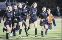  ??  ?? Bethlehem celebrates after winning the Class AA girls’ soccer championsh­ip with a 2-1 victory over Shen at Stillwater High School on Monday.