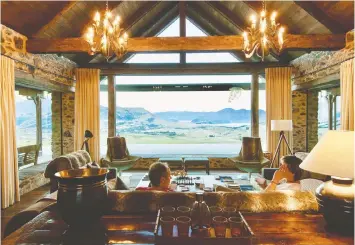  ??  ?? Mahu Whenua is an eco-friendly luxury lodge offering spectacula­r views and a range of activities, from horseback riding to heli-skiing, yoga and massage.
