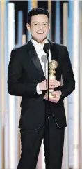 ?? PAUL DRINKWATER THE ASSOCIATED PRESS ?? Rami Malek accepted the award for best actor in a motion picture drama for his role as Freddie Mercury in “Bohemian Rhapsody.”