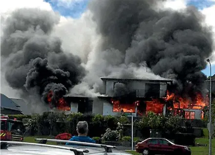  ?? ROBERT STEVEN/STUFF ?? A fire rips through a house on Arrowsmith Rd in Taupo.