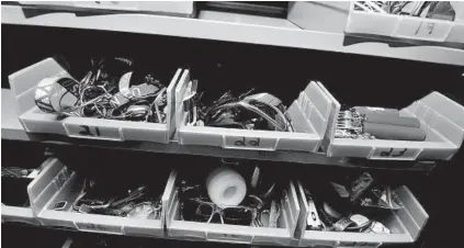  ?? KIM HAIRSTON/BALTIMORE SUN PHOTOS ?? TSA agents collect items both surrendere­d and forgotten at BWI checkpoint­s at a warehouse near the airport.