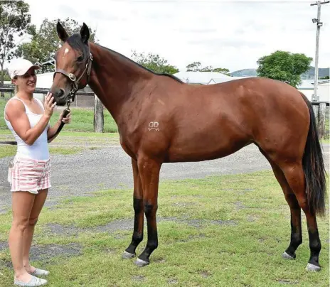  ?? Photo: Bev Lacey ?? OFF TO MARKET: Toowoomba jockey Skye Bogenhuber with her Husson-Temple Girl filly who will be offered at next week’s Gold Coast March Yearling Sale on the Gold Coast.