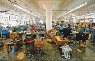  ?? Claire Hannah Collins Los Angeles Times ?? CALIFORNIA garment workers produce most American-made fashion. Under the current piece-rate system, they earn as little as 5 cents to sew a side seam.