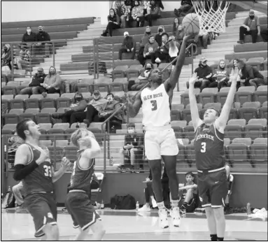  ?? Photo by Alexis Meeks ?? Glen Rose’s Ahmad Holmes goes up for a basket against Bismarck’s Kalem Rorie during Tuesday’s game at the Glen Rose Arena. To see Holmes score the opening points in Tuesday’s game check out the Malvern Daily Record’s website at www.malvern-online.com