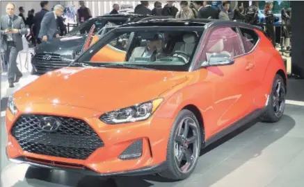  ??  ?? The 2019 Hyundai Veloster’s stance is more muscular, with higher-volume fenders and wheel arches that are neatly filled with the standard 18-inch alloy wheels.