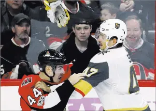  ?? Fred Chartrand ?? The Associated Press Golden Knights defenseman Luca Sbisa (47) fights Ottawa Senators center Jean-gabriel Pageau during Vegas’ 5-4 victory Nov. 4 in Ottawa, Ontario. Sbisa, who has a lower-body injury, will not be with the team this week for road games...