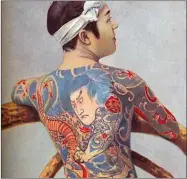  ??  ?? A man with Japanese tattoos in 1902