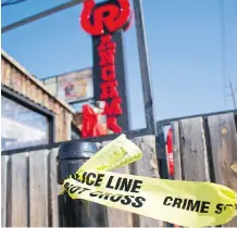  ?? ZACH LAING ?? Broken glass, tire tracks and a strand of police tape were all that remained Saturday after a police chase and officer-involved shooting the day before outside Ranchman’s on Macleod Trail.