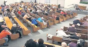  ?? AP ?? In this still frame from a livestream­ed video, churchgoer­s take cover while a congregant armed with a handgun, top left, engages a man who opened fire.