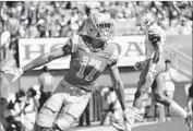  ?? Robert Gauthier Los Angeles Times ?? CHRISTIAN PABICO of UCLA celebrates his first career touchdown reception in the first quarter.