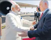  ?? PTI ?? Prime Minister Narendra Modi greets his Israeli counterpar­t Benjamin Netanyahu at the Ben Gurion airport in Tel Aviv on Tuesday.