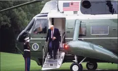  ?? Saul Loeb / AFP via Getty Images ?? President Donald Trump steps off Marine One after arriving on the South Lawn of the White House in Washington, D.C. on Thursday.