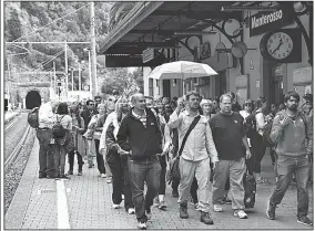  ?? Rick Steves’ Europe/CAMERON HEWITT ?? Tour groups can crowd Cinque Terre train platforms in peak season.