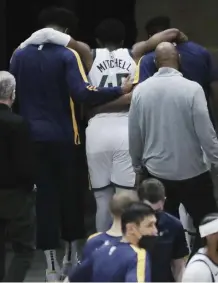  ?? Ap ?? HOLDING THEIR BREATH: The Jazz are waiting for an update after guard Donovan Mitchell had to be helped off the court after an ankle injury yesterday.
