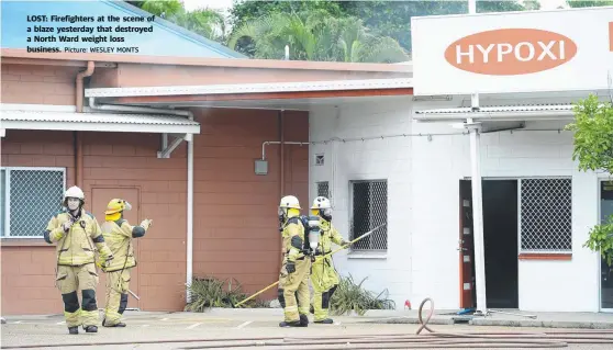  ?? Picture: WESLEY MONTS ?? LOST: Firefighte­rs at the scene of a blaze yesterday that destroyed a North Ward weight loss business.