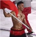  ?? STEVE RUSSELL/TORONTO STAR ?? Cold? What cold? Tongan Pita Taufatofua polished his reputation as the barest of flag-bearers, reprising his role from decidedly warmer Rio.