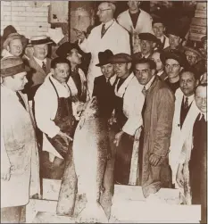  ?? PHOTO PROVIDED ?? In this 1934 photo provided by H. Forman & Son, Louis Forman, center, Lance Forman’s grandfathe­r, is photograph­ed with a large wild salmon at Billingsga­te Market in London.