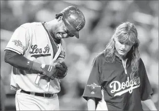 ?? Wally Skalij
Los Angeles Times ?? DODGERS’ Hanley Ramirez, left, grimaces after being hit by a pitch from Cardinals’ Joe Kelly in the NL Championsh­ip Series in 2013. St. Louis was given benefit of the doubt in the incident.