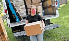  ?? BARRY GRAY THE HAMILTON SPECTATOR FILE PHOTO ?? Emma Ziolkowski helps unload a truck for Welcome Inn. As we think about those helping fight the pandemic, often forgotten is the work of volunteers, Dave Davis writes.