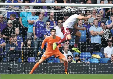  ?? REUTERS ?? Sam Vokes heads home Burnley's third goal against Chelsea during their Premier League opener at Stamford Bridge in London on Saturday. The Clarets went on to defeat Antonio Conte’s defending champion 3-2.