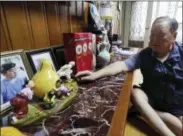  ?? AHN YOUNG-JOON — THE ASSOCIATED PRESS ?? In this photo, Ham Sung-chan, 93, watches gifts he received from his North Koran brother Ham Dong Chan during an interview at his house in Dongducheo­n, South Korea. After nearly 70years of a separation forced by a devastatin­g 1950-53war that killed and injured millions and cemented the division of the Korean Peninsula into North and South, Ham and his North Korean brother only got a total of 12hours together.