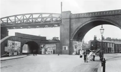  ?? Roy F Burrows Midland Collection Trust/ Kiddermins­ter Railway Museum ?? A circa 1906 view of Horns Bridge from its north side, looking south-east with Derby Road going off to the right, and the road to Mansfield to the left. The latter passes under a masonry skew bridge that carries the Midland main line, while above this is the viaduct carrying the LD&ECR line from Langwith Junction towards Chesterfie­ld (Market Place), from left to right for incoming trains. The GCR line is not seen from this angle – the LD&ECR passes it a short distance to the left, so it is curving in from the left and will soon pass under the MR behind the photograph­er. Whilst all these lines created an extraordin­ary meeting place, their promoters did not see fit to have them connected.