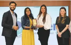  ??  ?? Ashly Jason, an emergency department nurse from Aster
■ Med City in Kochi, receives a memento during a felicitati­on ceremony to honour the Covid-19 warriors.