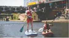  ?? VISIT BRITAIN ?? Kayaking and standup paddleboar­ding canal tours are offered from the Roundhouse in central Birmingham.